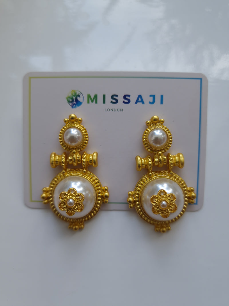 Gold door knocker style earrings