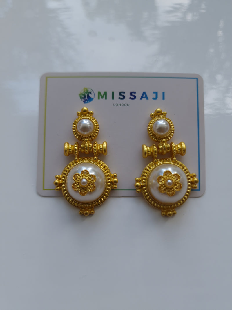 Gold door knocker style earrings